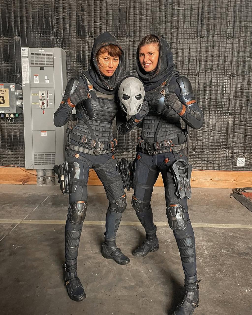 Olga Kurylenko and her stunt double on the set of .jpg