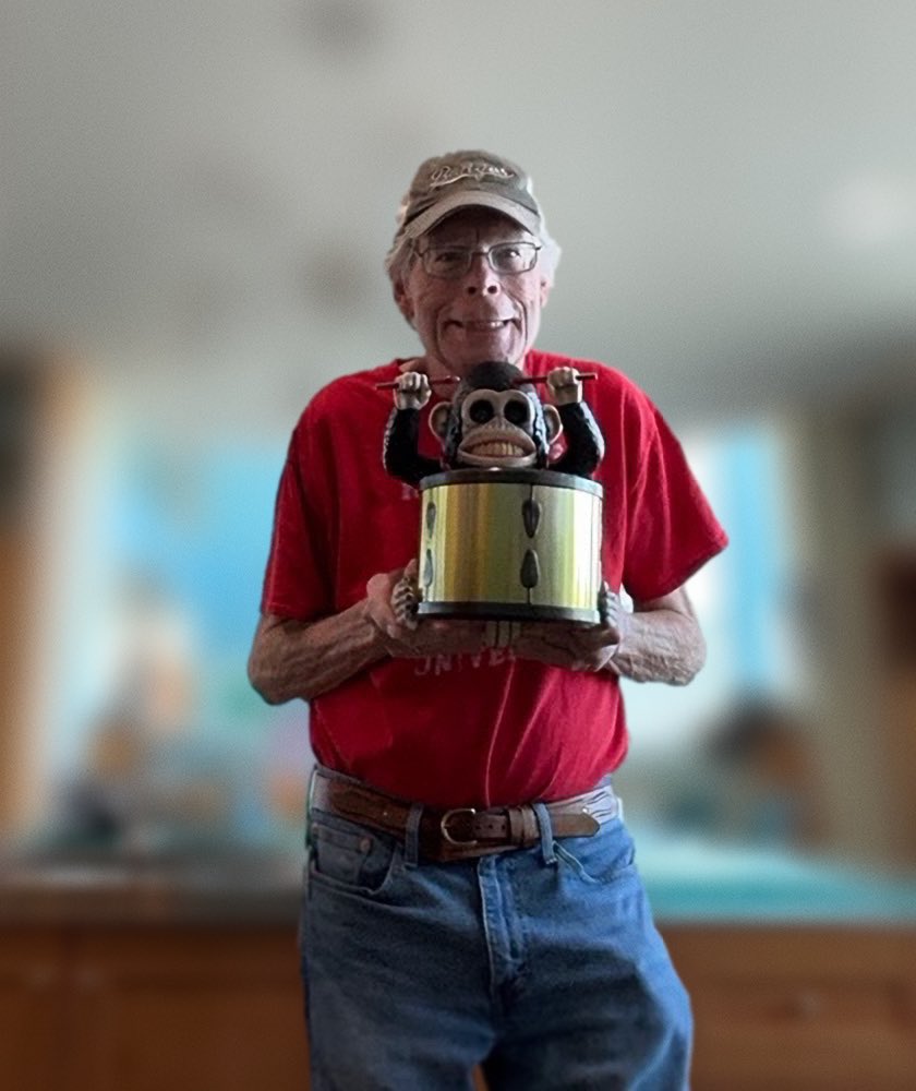 Stephen King with ‘THE MONKEY’ popcorn bucket.jpg