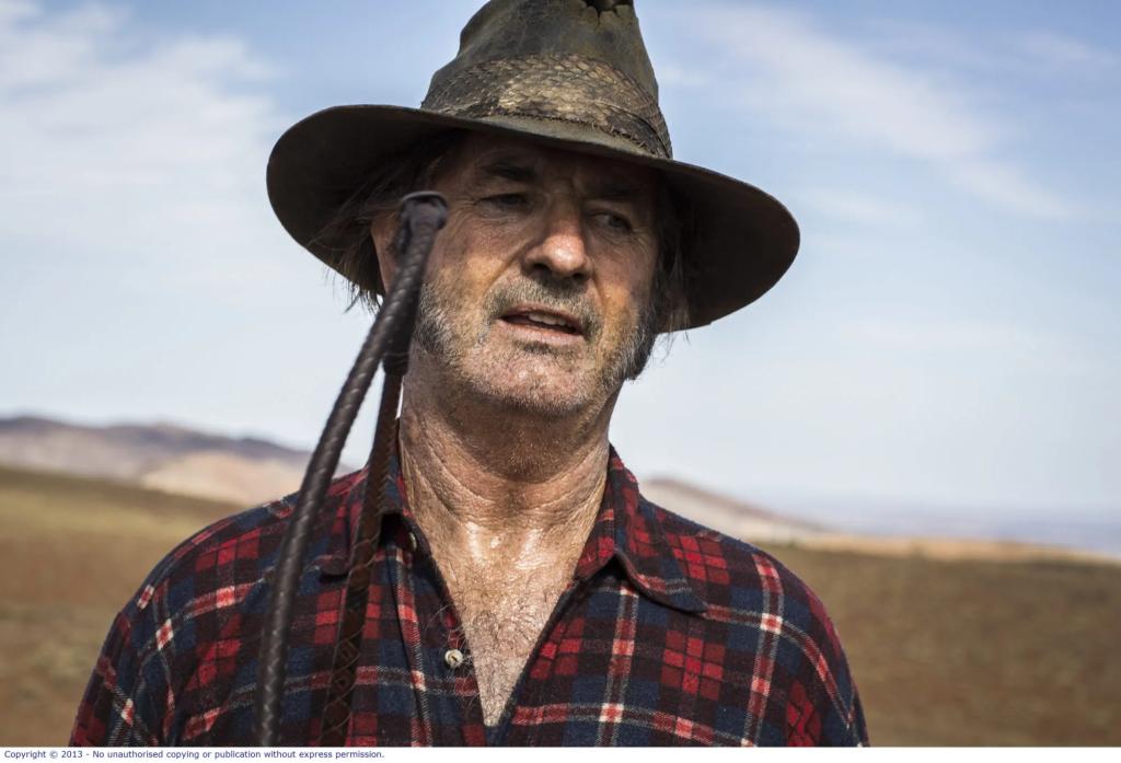 WolfCreek2_John-Jarratt-as-Mick-Taylor_portrait-3-e1726861405786.webp.jpg