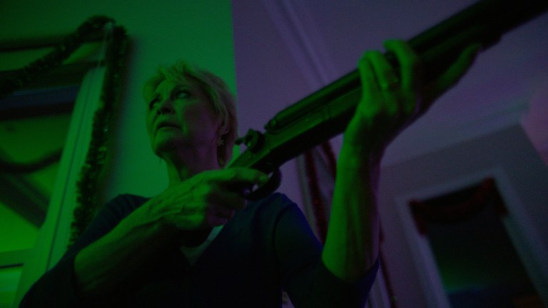 Dee-Wallace-Gun-Green-Red-Christmas-Photo-by-Douglas-Burgdorff.jpeg