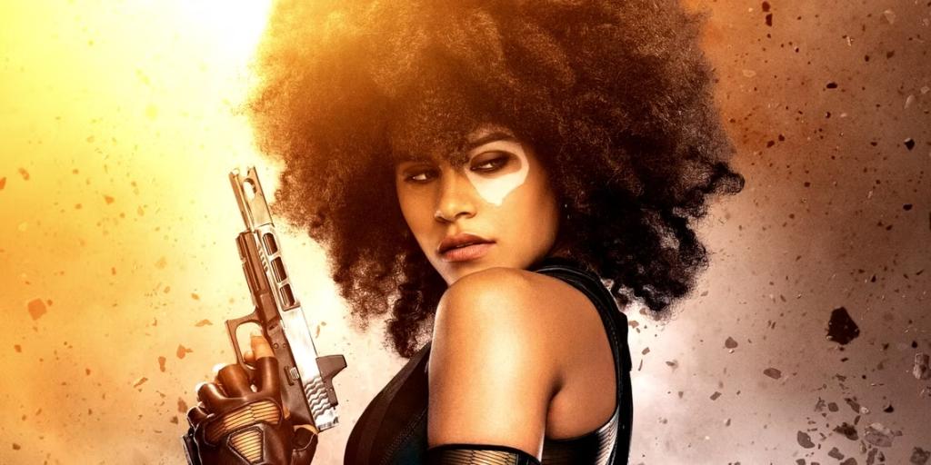 zazie-beetz-s-domino-wields-a-gun-and-looks-to-her-side-in-deadpool-2.jpg