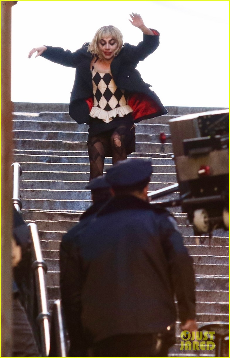 lady-gaga-joaquin-phoenix-song-dance-stairs-help-fall-over-02.jpg