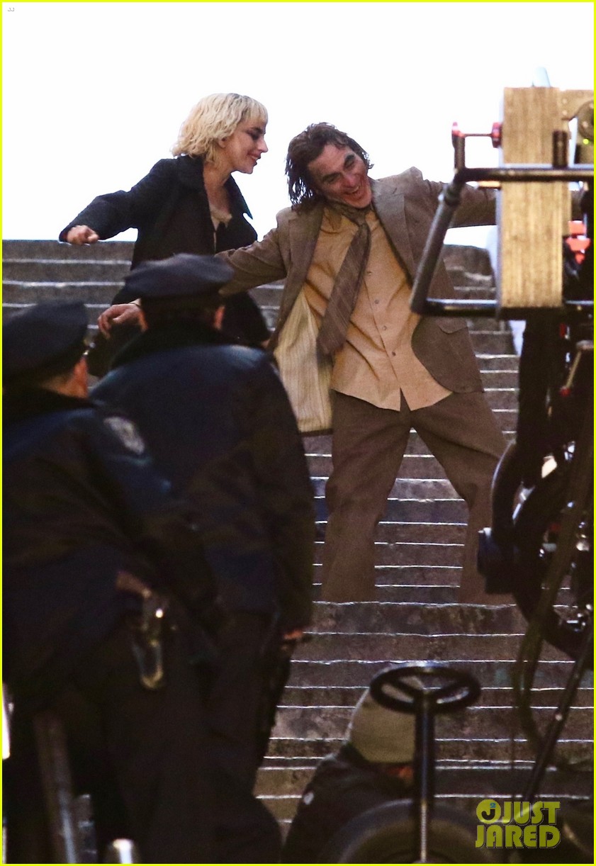 lady-gaga-joaquin-phoenix-song-dance-stairs-help-fall-over-01.jpg