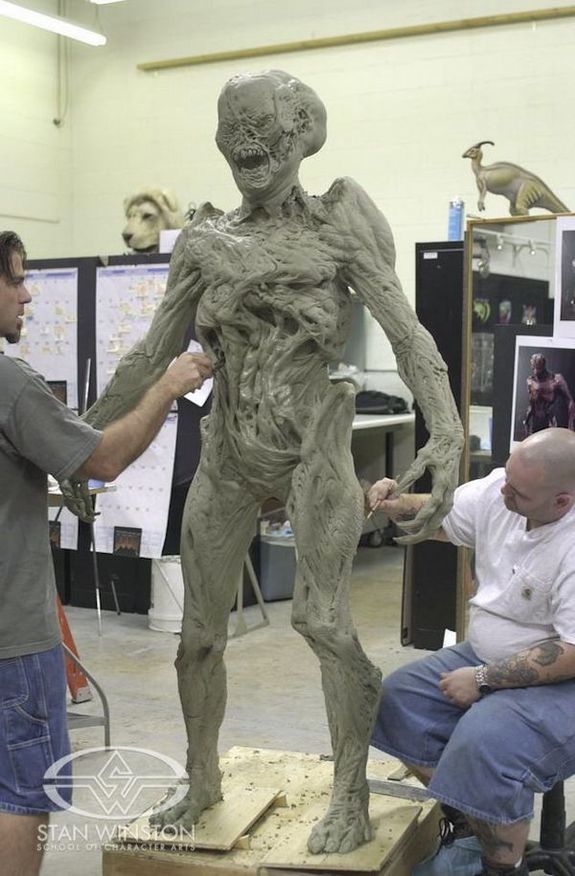 content_rob_ramsdell_and_john_cherevka_detail_the_grotesque_form_of_a_stan_winston_studio_imp_monster_suit_from_doom.jpg