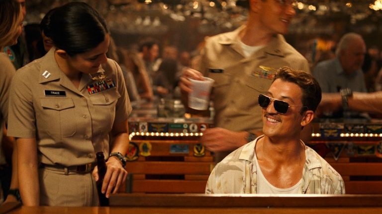 Miles-Teller-and-Monica-Barbaro-singing-in-Top-Gun-Maverick.jpg