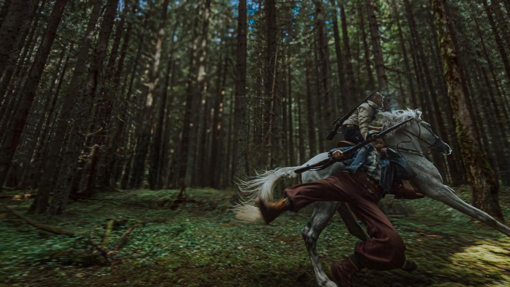 hope-2026-person-on-a-horse-person-with-gun-being-dragged-along.jpeg