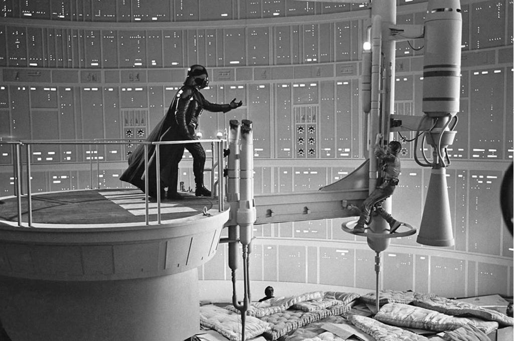 David-Prowse-and-Mark-Hamill-filming-the-classic-scene-in-The-Empire-Strikes-Back-above-a-bunch-of-mattresses-and-cardboard-boxes.jpg