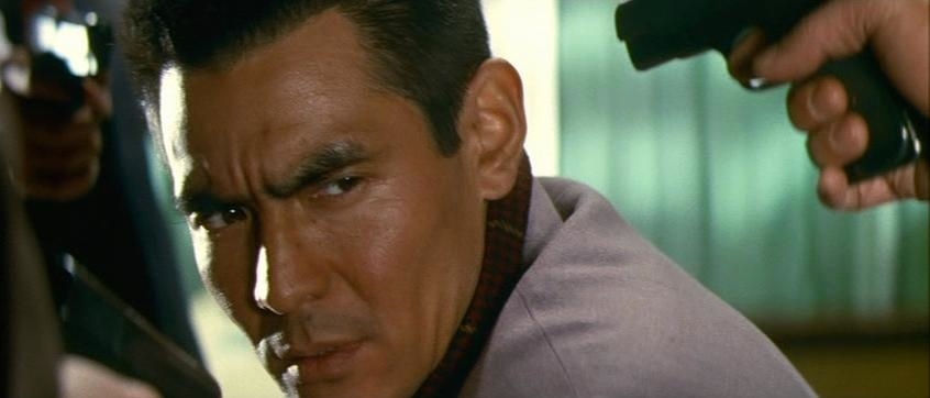battles-without-honor-and-humanity-1973-001-close-up-man-in-focus.jpg